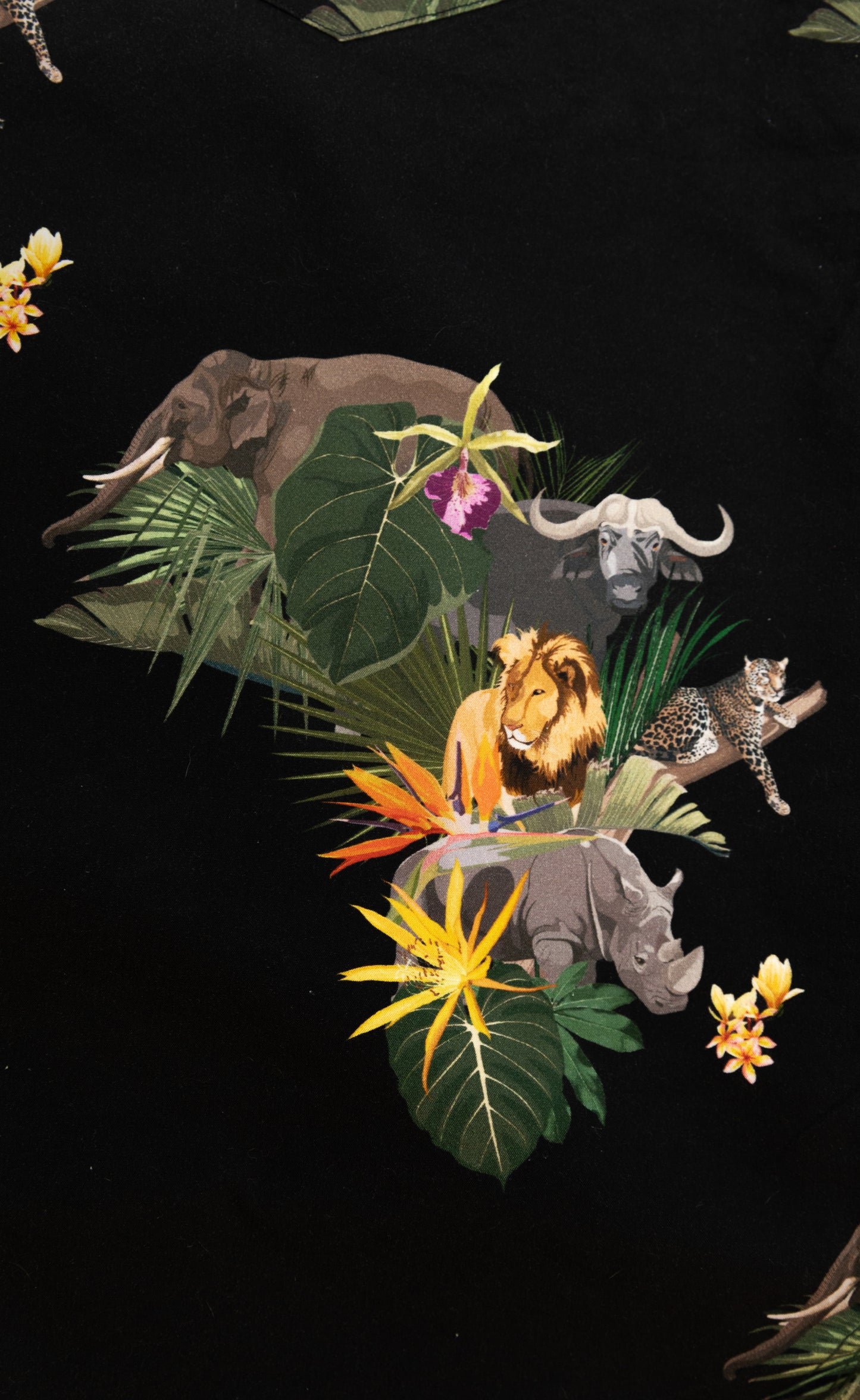 Big Five African shirt design with lion, elephant, leopard, rhino, and buffalo in vibrant jungle print on black fabric – Skyevrs limited edition.