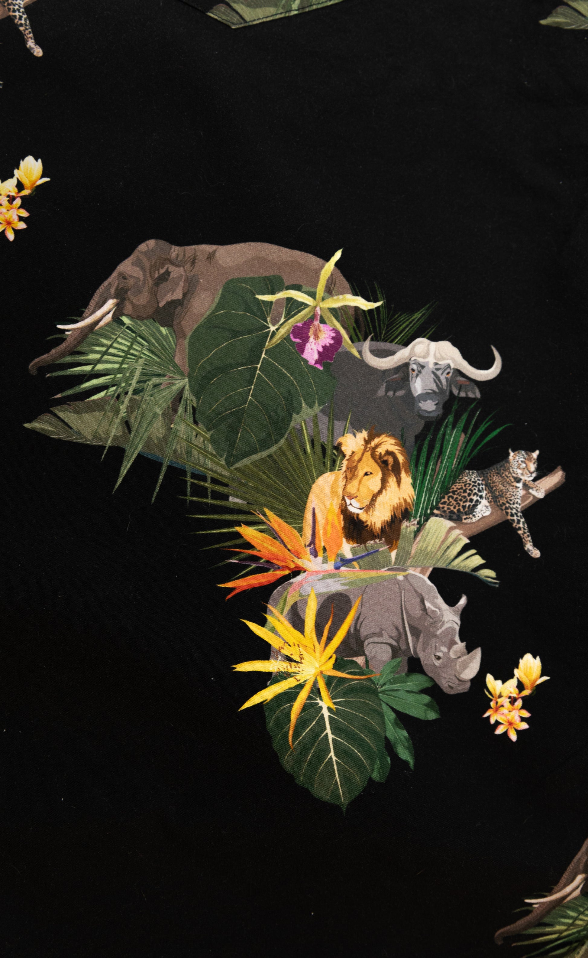 Big Five African shirt design with lion, elephant, leopard, rhino, and buffalo in vibrant jungle print on black fabric – Skyevrs limited edition.